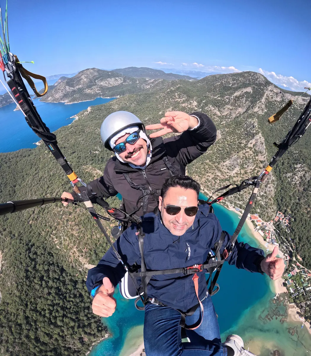 Safe landing after tandem paragliding flight in Fethiye beach area